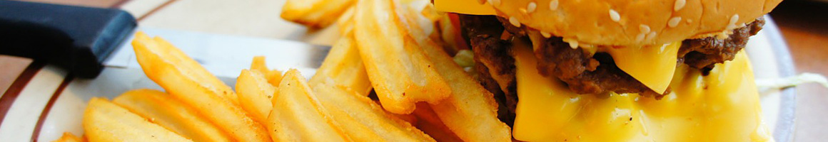 Eating Burger at Lee's Hamburgers restaurant in Metairie, LA.